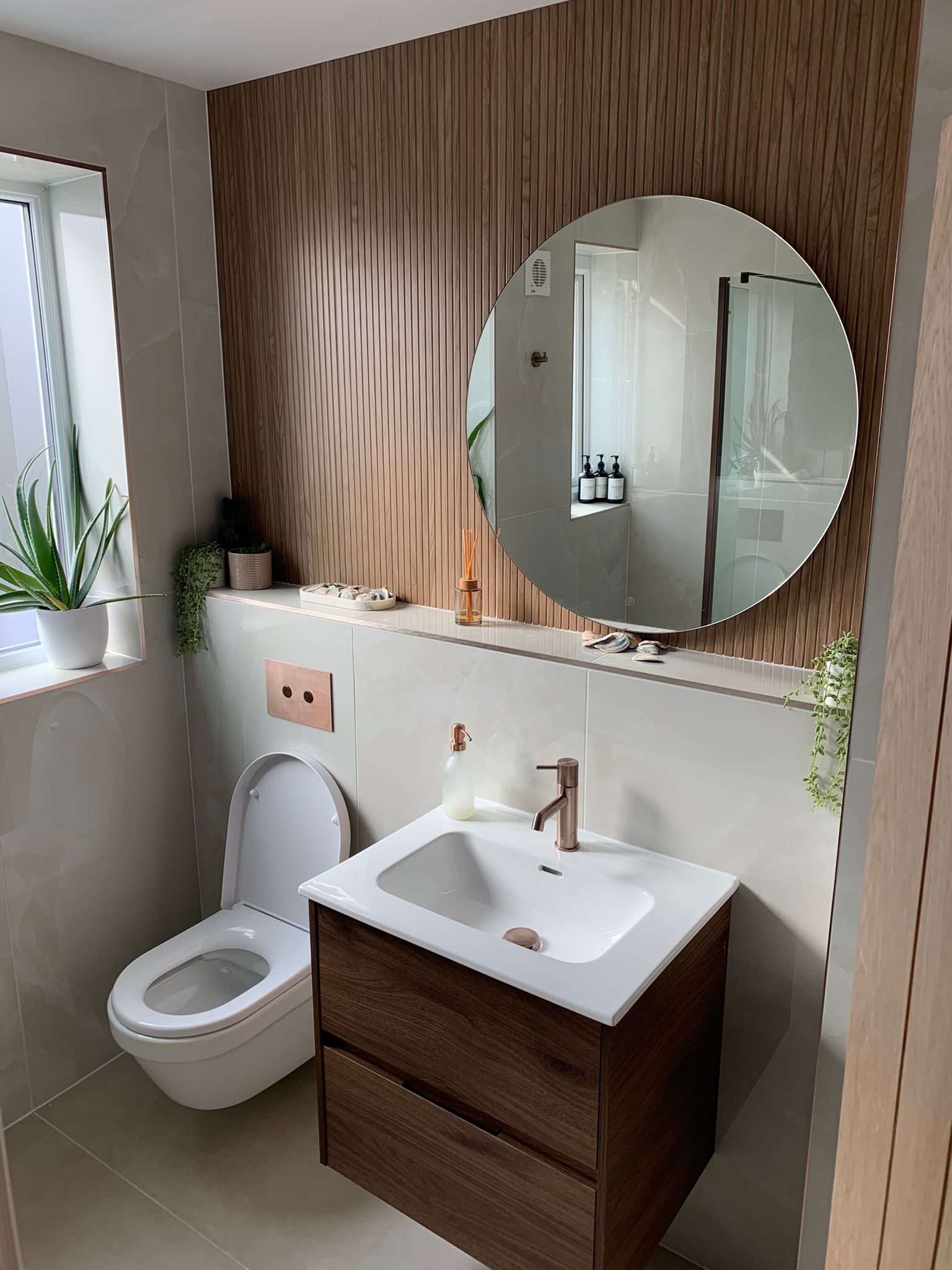 Modern bathroom with walnut vanity