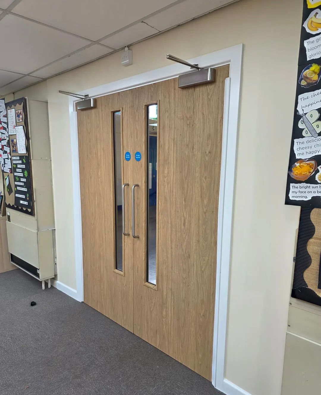 Oak double fire doors in school corridor