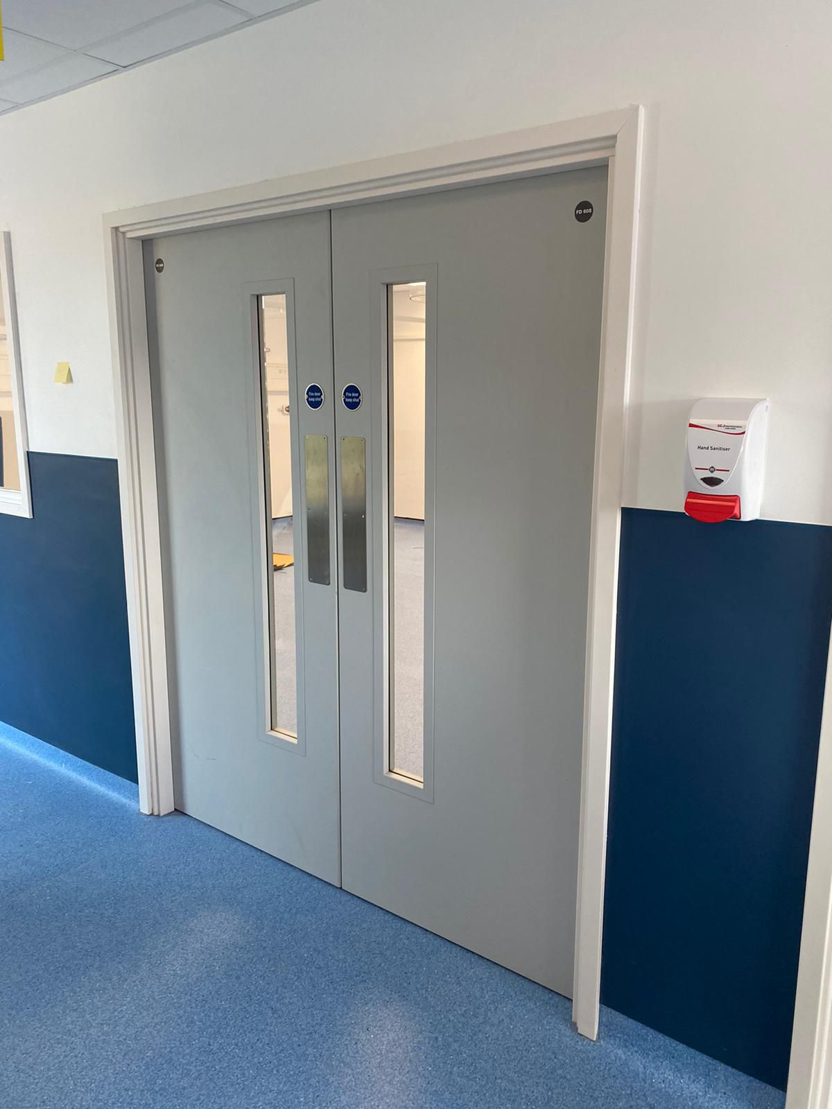 Light grey fire doors in corridor