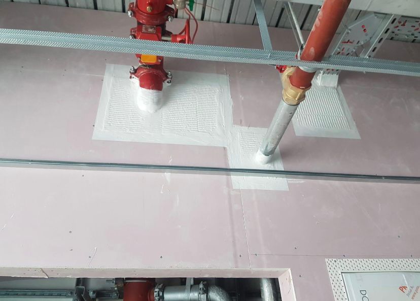 Fire-rated sealing around sprinkler pipework